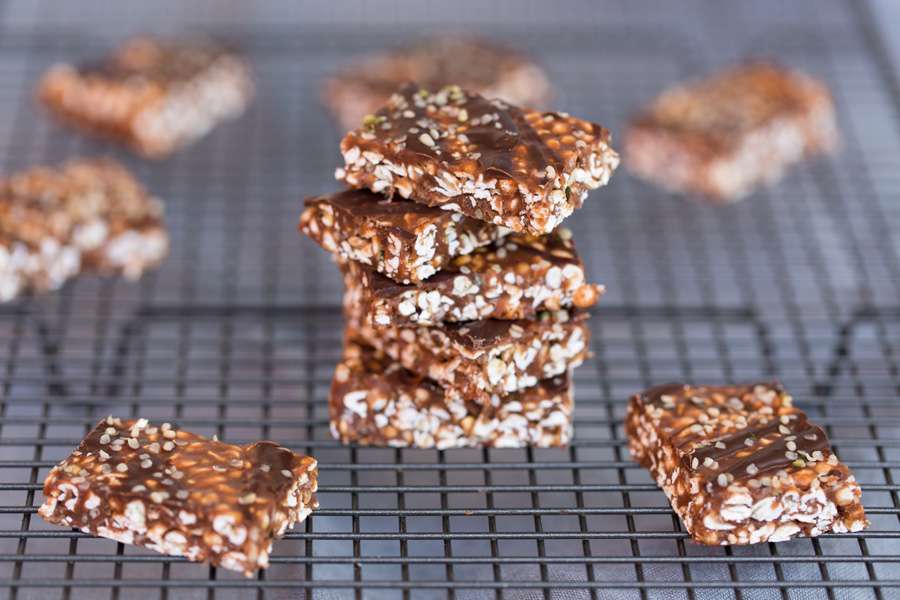 Buckwheat and hemp seed bars sprinkled with bittersweet chocolate