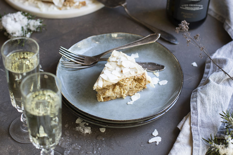 Coconut cake with coconut flakes and a coconut-almond cream
