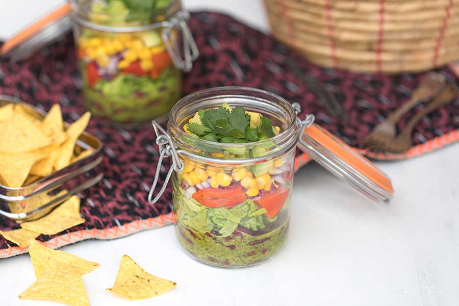 Mexican layer salad with coriander-lime dressing