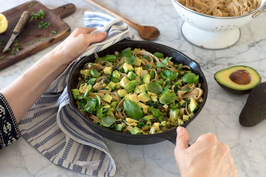 Green tagliatelle with avocado, peas and fresh herbs