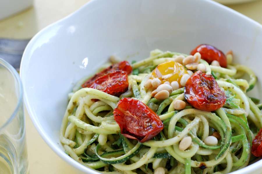 Zucchini noodles with pesto verde, roasted tomatoes and cedar nuts