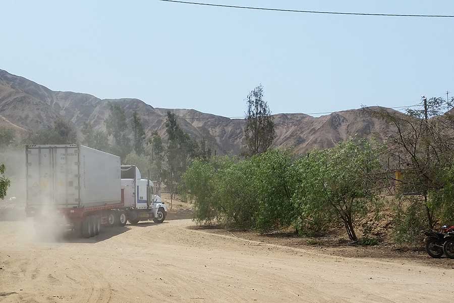 On their way to Europe! A truck transports a batch of HAND IN HAND pecans to the nearby container port.