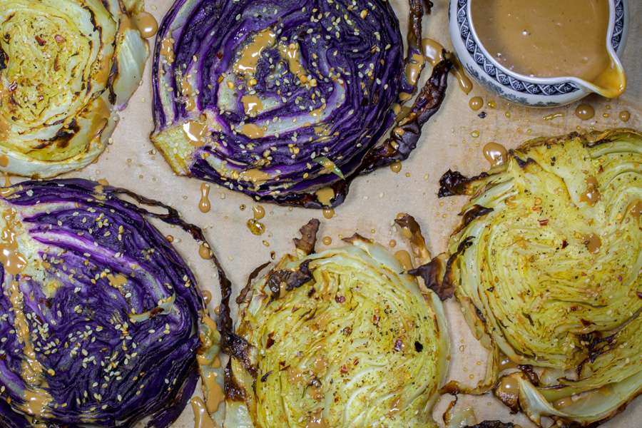 Roasted cabbage steaks with sesame seeds and orient dressing