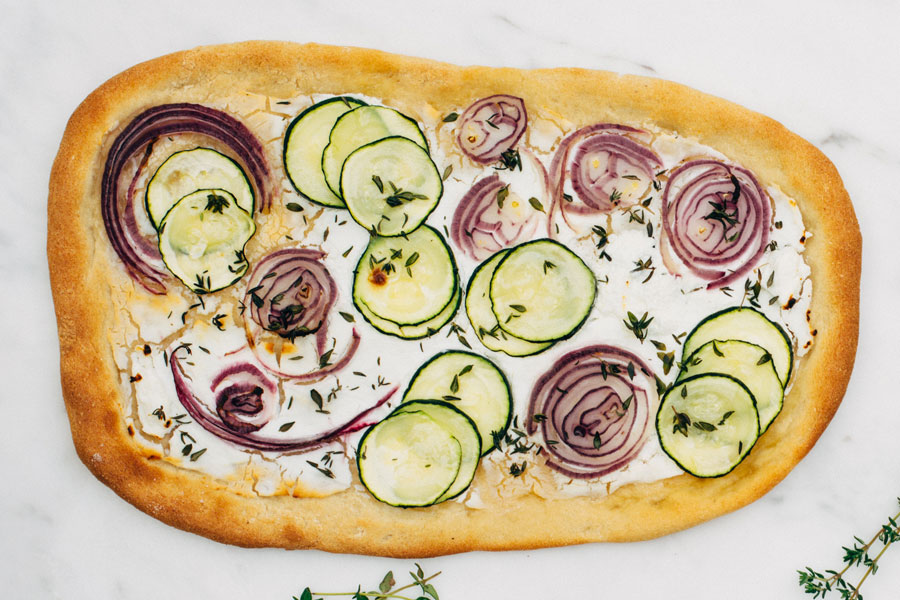 Pizza with goat cheese and zucchini