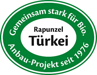 Abbildung des Siegels vom Rapunzel Türkei Projekt. Der Text auf dem Siegel lautet "Gemeinsam stark für Bio. Anbau-Projekt seit 1976."