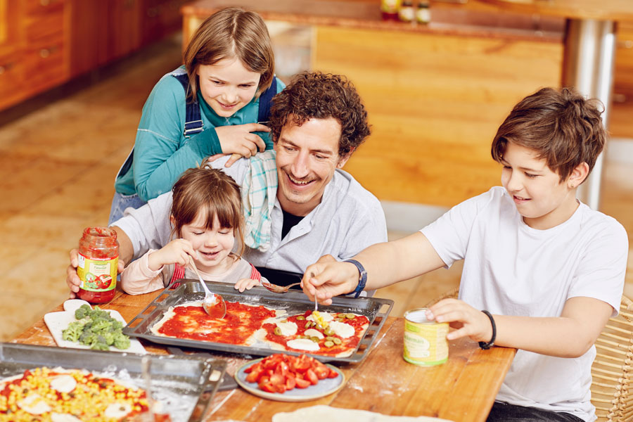 Topping pizza together with your kids