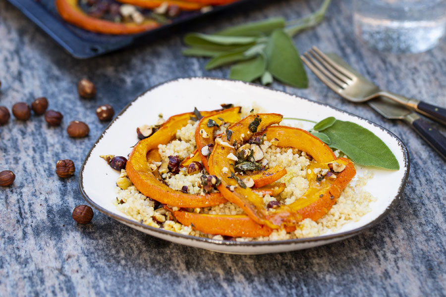 Caramelized pumpkin wedges with hazelnuts and sage